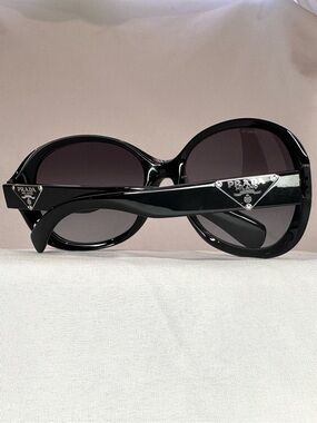 Prada Black Round Sunglasses with Silver Logo Plaques